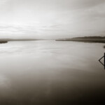 Stripped of the typical colors of sunrise, the salt marsh shows us its unique character of light.<br /><br /> B&W image of Wimbee Creek SC